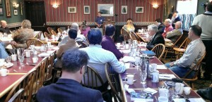 Members intently listen to speaker Andrew Barndt.