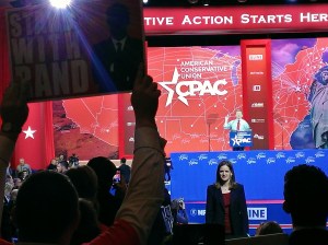 An enthusiastic supporter of straw poll victor Rand Paul holds a sign during his speech to CPAC.